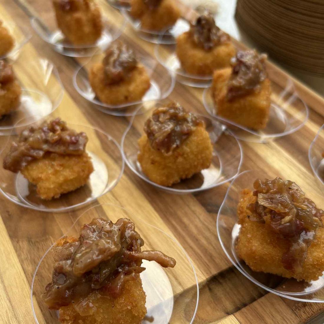 Canapés arranged on wooden boards